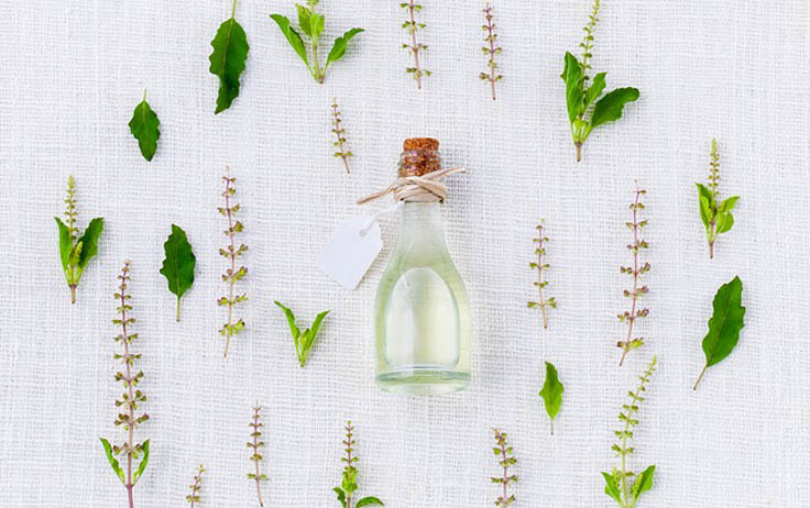 A form of alternative medicine that uses volatile plant materials, known as essential oils, and other aromatic compounds for the purpose of altering a person